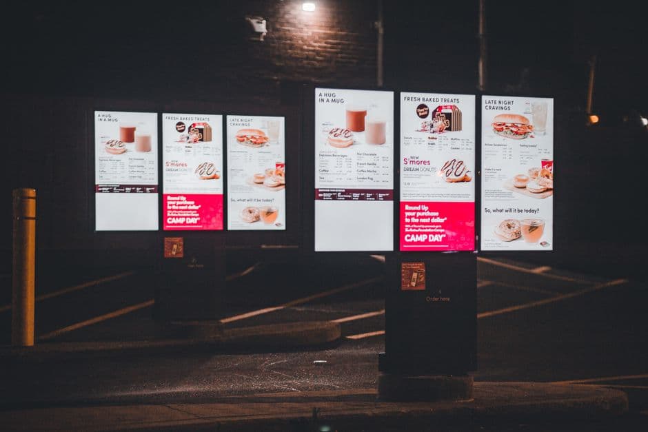 Smartphone showing a restaurant digital menu with reordered categories and featured items