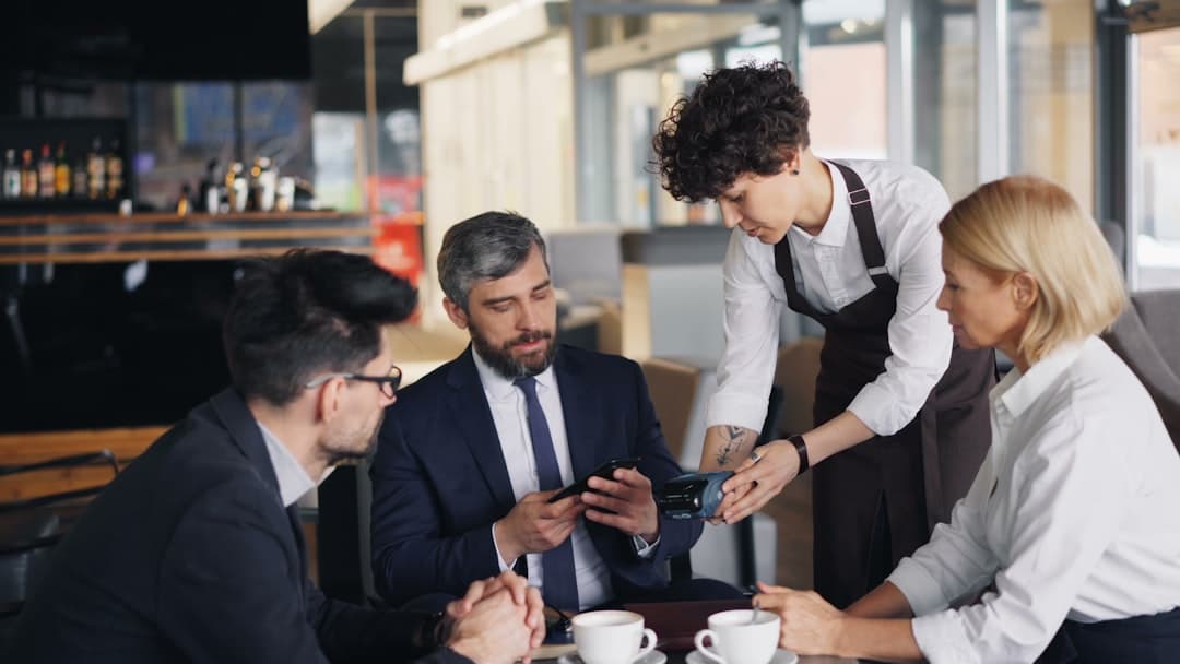 Restaurant operations team planning digital menu updates for one or more locations