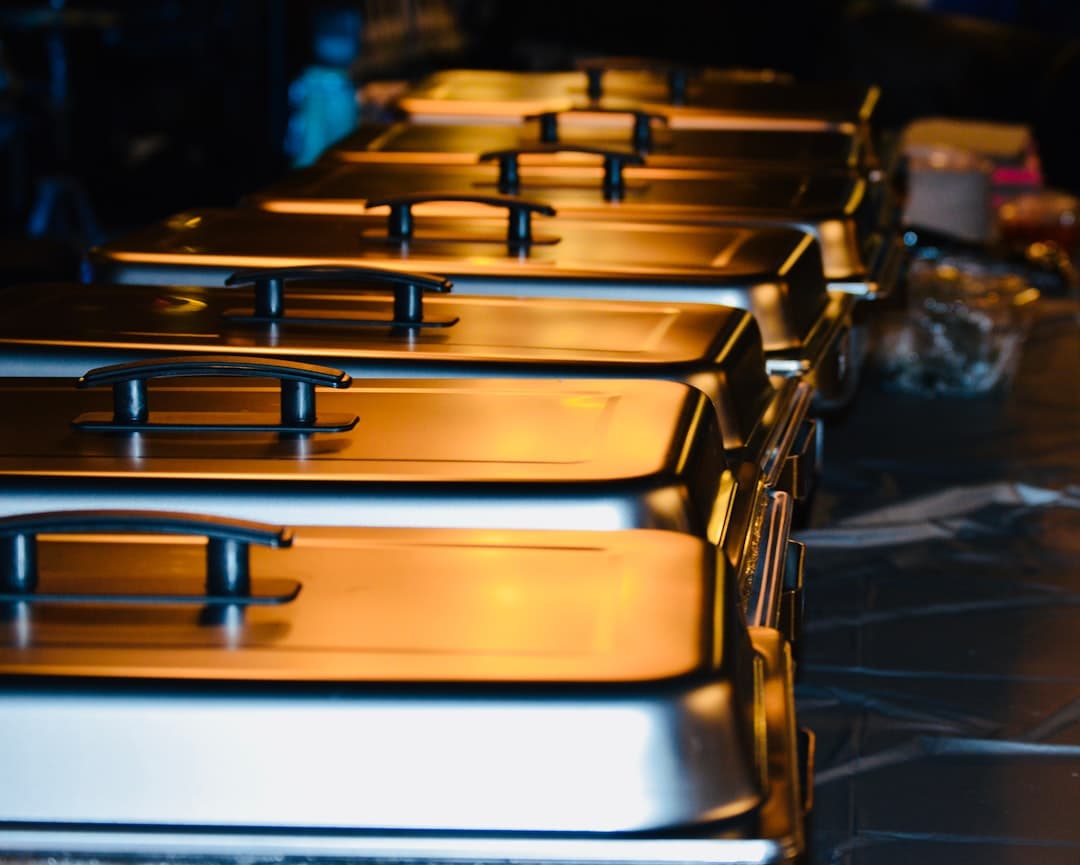 Restaurant team preparing large catering trays for a scheduled order with deposit