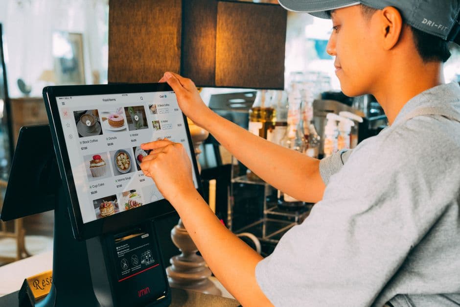 Customer using a digital restaurant menu with helpful food and drink pairing suggestions