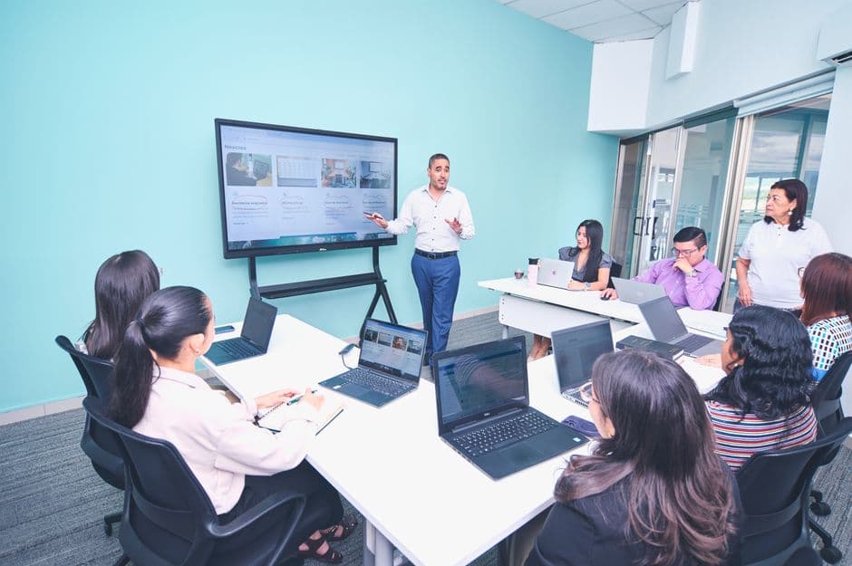 Restaurant group manager reviewing digital menu updates for multiple store locations