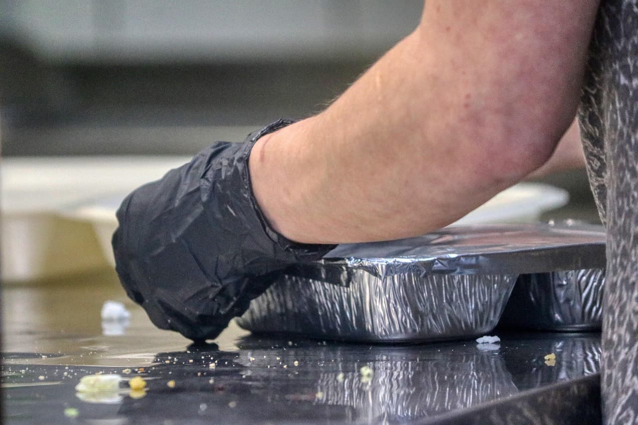 Restaurant staff managing online orders in the kitchen