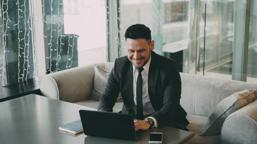 Restaurant manager reconciling daily sales reports and Stripe payouts on a laptop