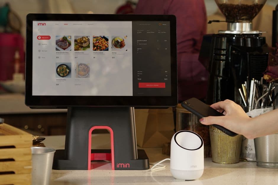 Restaurant owner reviewing digital menu performance and category placement on a tablet