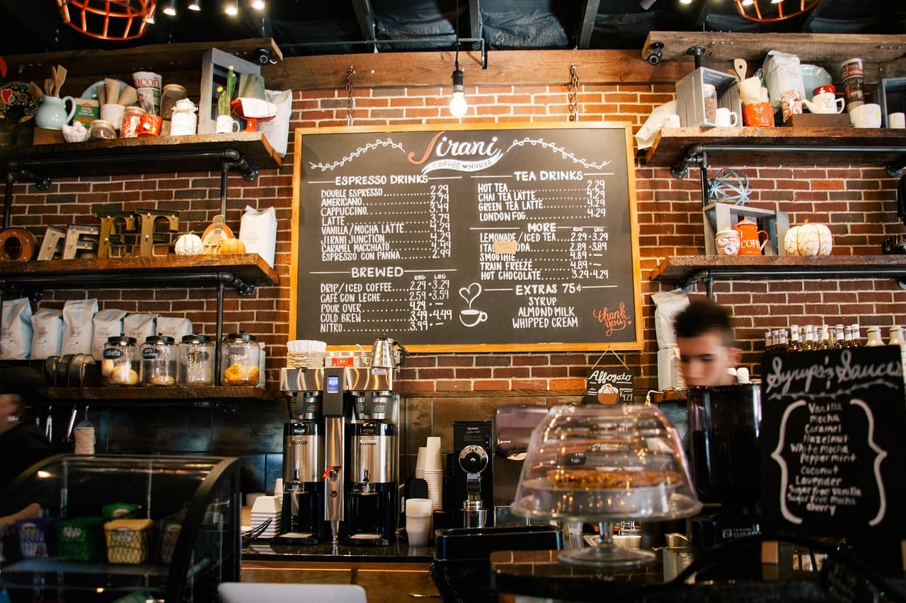 Restaurant owner reviewing a mobile digital menu and ordering experience on a smartphone.