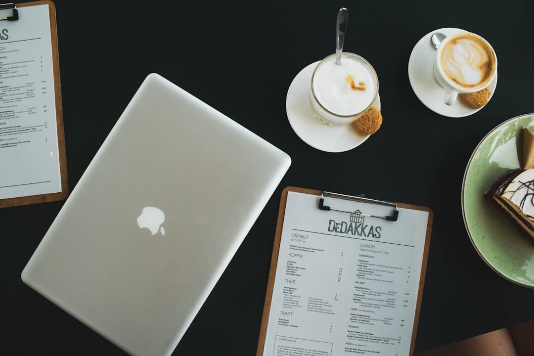Restaurant owner reviewing digital menu software options with a checklist