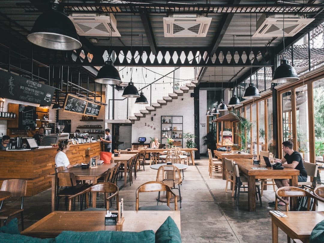 Restaurant manager reconciling daily online orders with payout reports